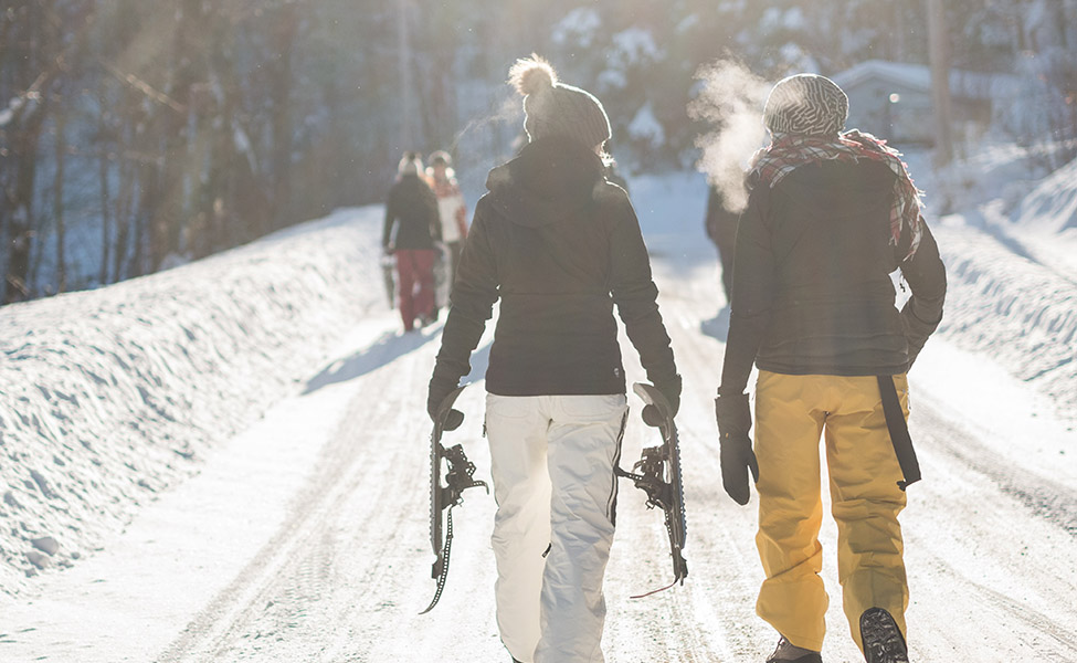 A girl and a boy go to ski on the French Alps