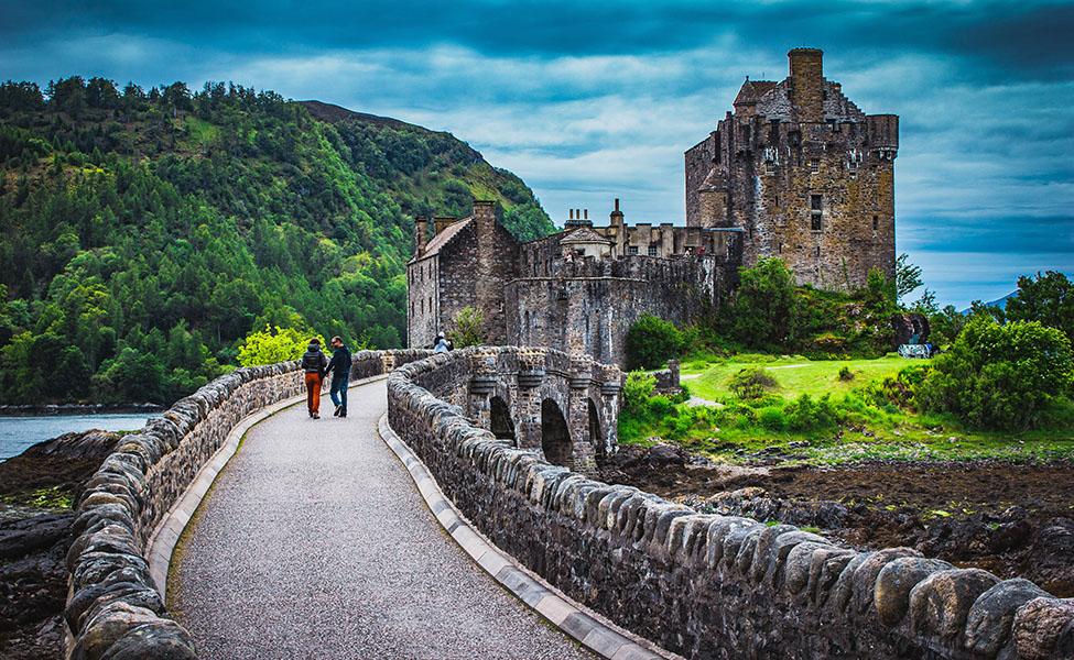 A couple walking towards castle