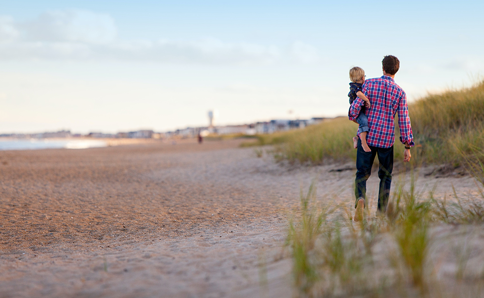 father and son on the beach