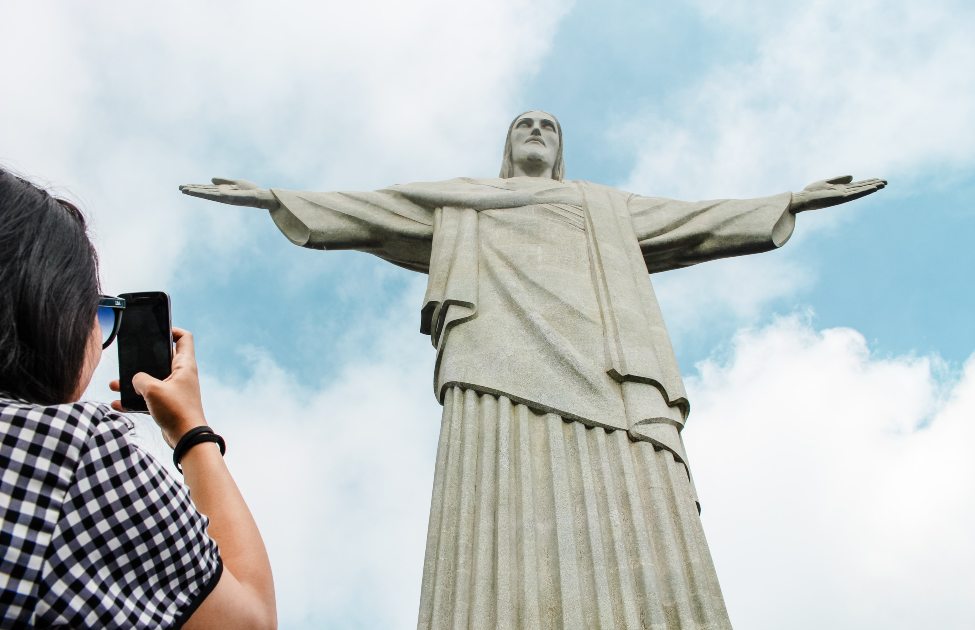 Tourist in front of Cristo Redentor 