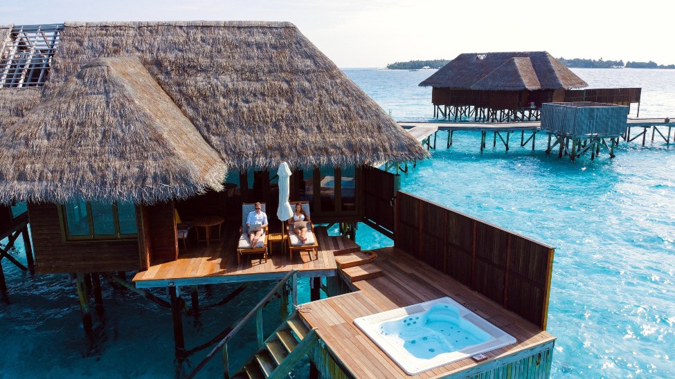 Two people on a water bungalow