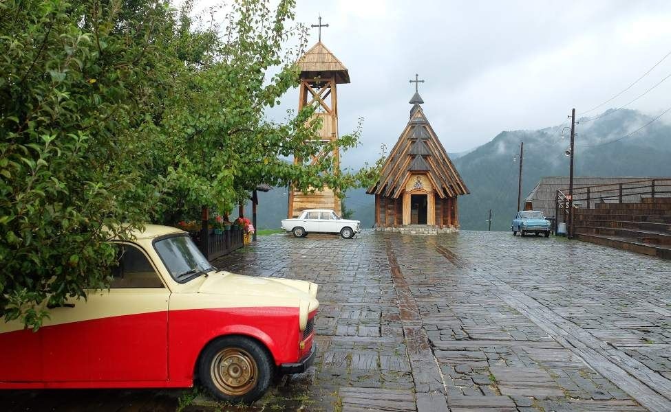 wooden church and vintage car in kustendorf