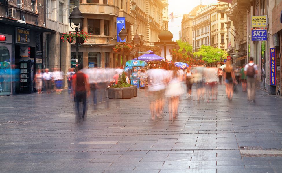 People walking through a street in Belgrade