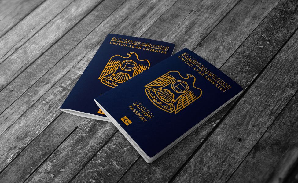 UAE passports on a wooden floor